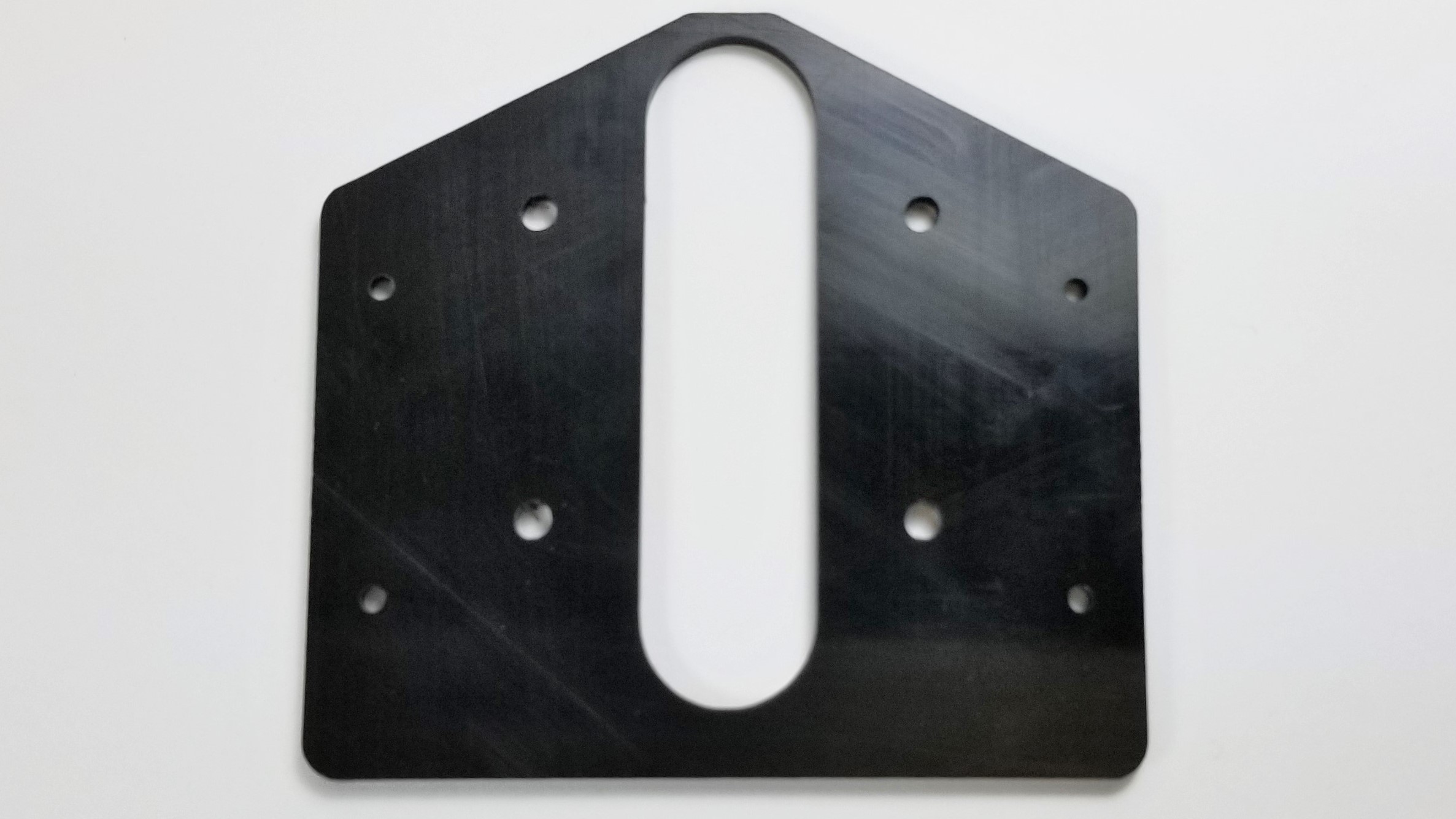 20113 ABS Bracket. Machined to size with a CNC router, these brackets are used in the assembly of an autonomous vehicle.	