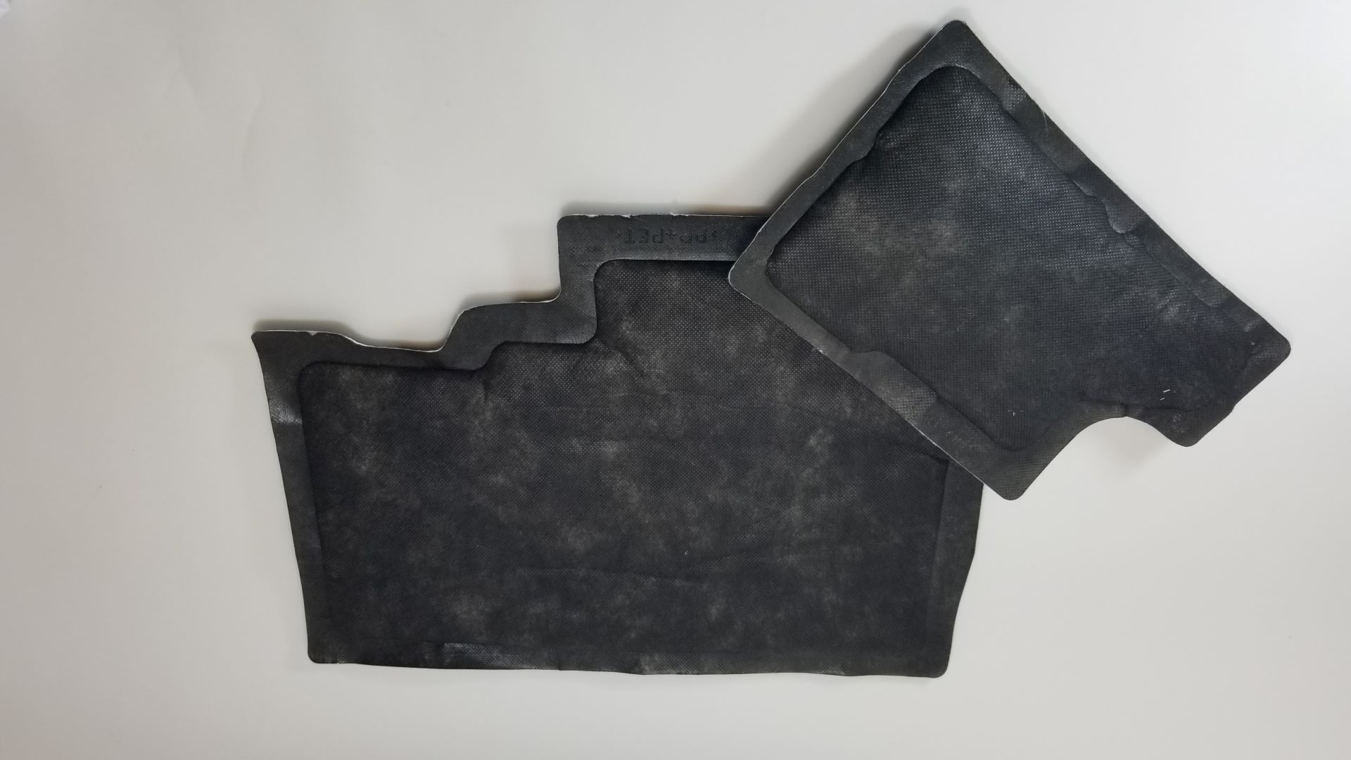 Car sound insulation. Made with a heat seal die, these insulators will dampen road noise in high end vehicles. 