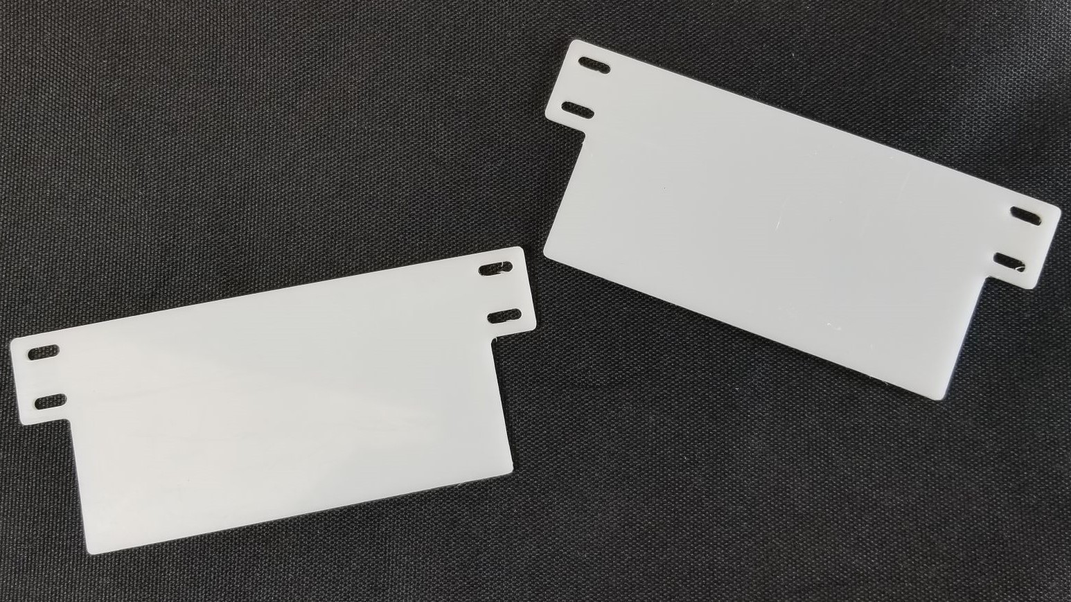 White Polycarbonate trim pieces. Made with a CNC router. 